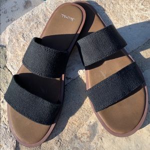 Black Sanuk slides